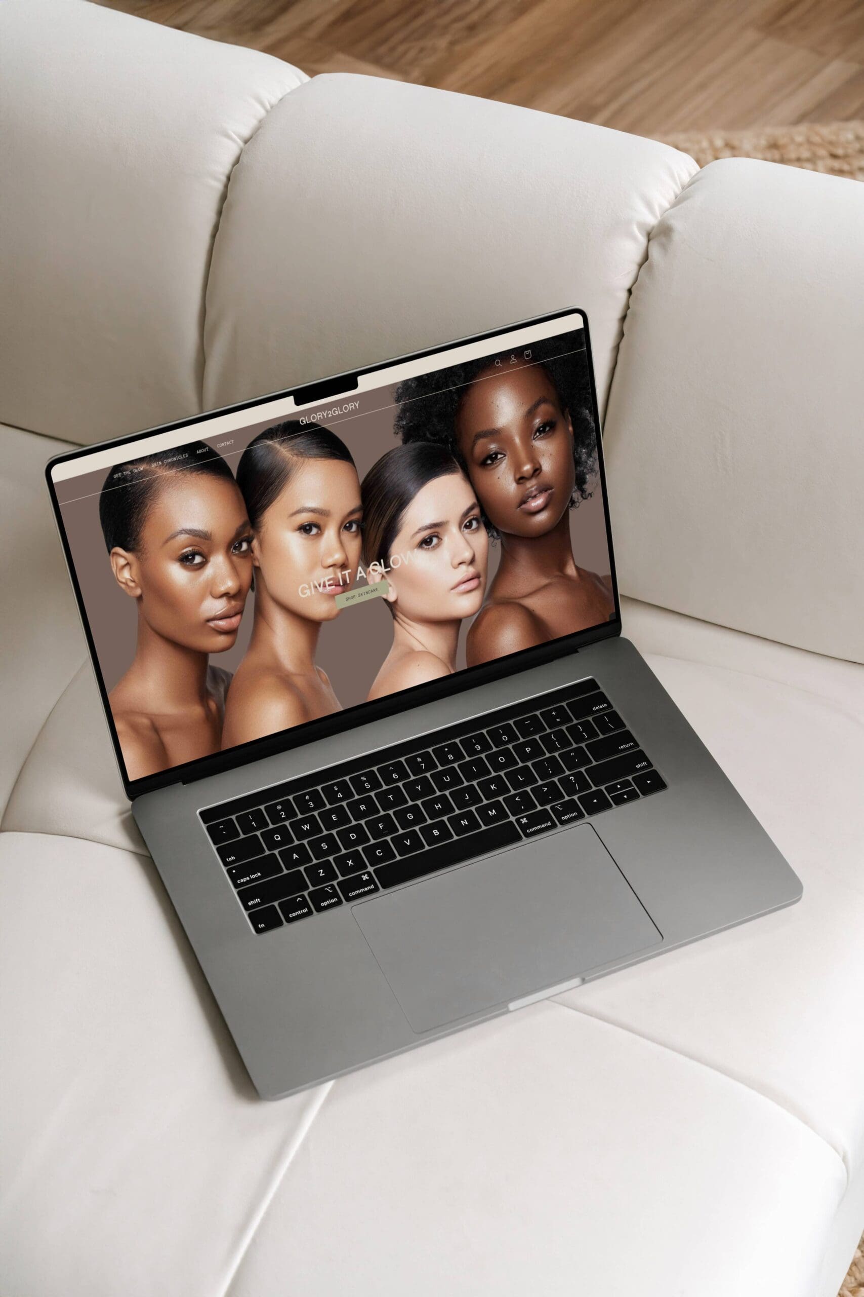 Laptop displaying a beauty brand Shopify homepage featuring diverse models, highlighting 2025 design trends for fashion and beauty e-commerce.